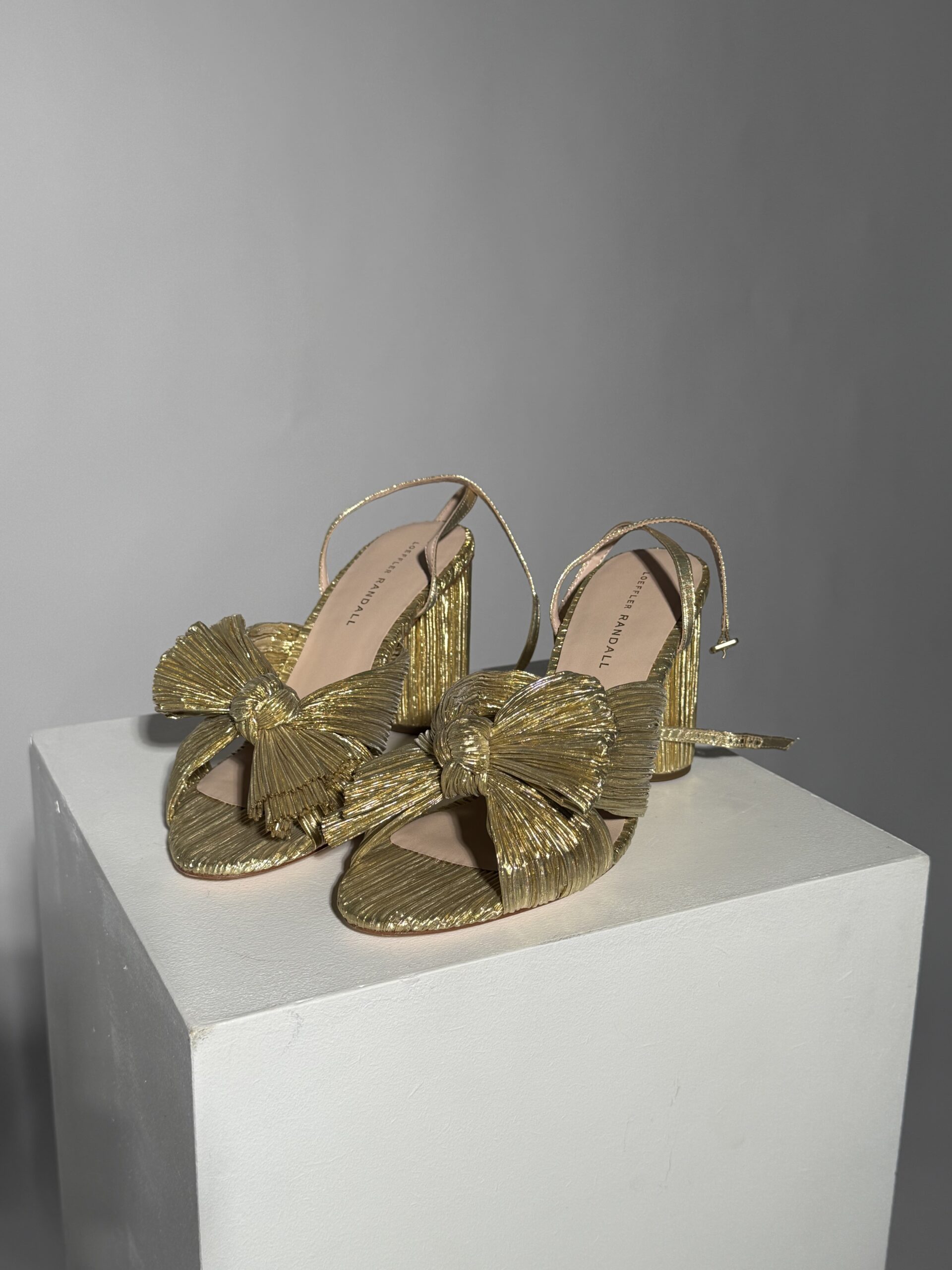 Gold pleated knot sandals